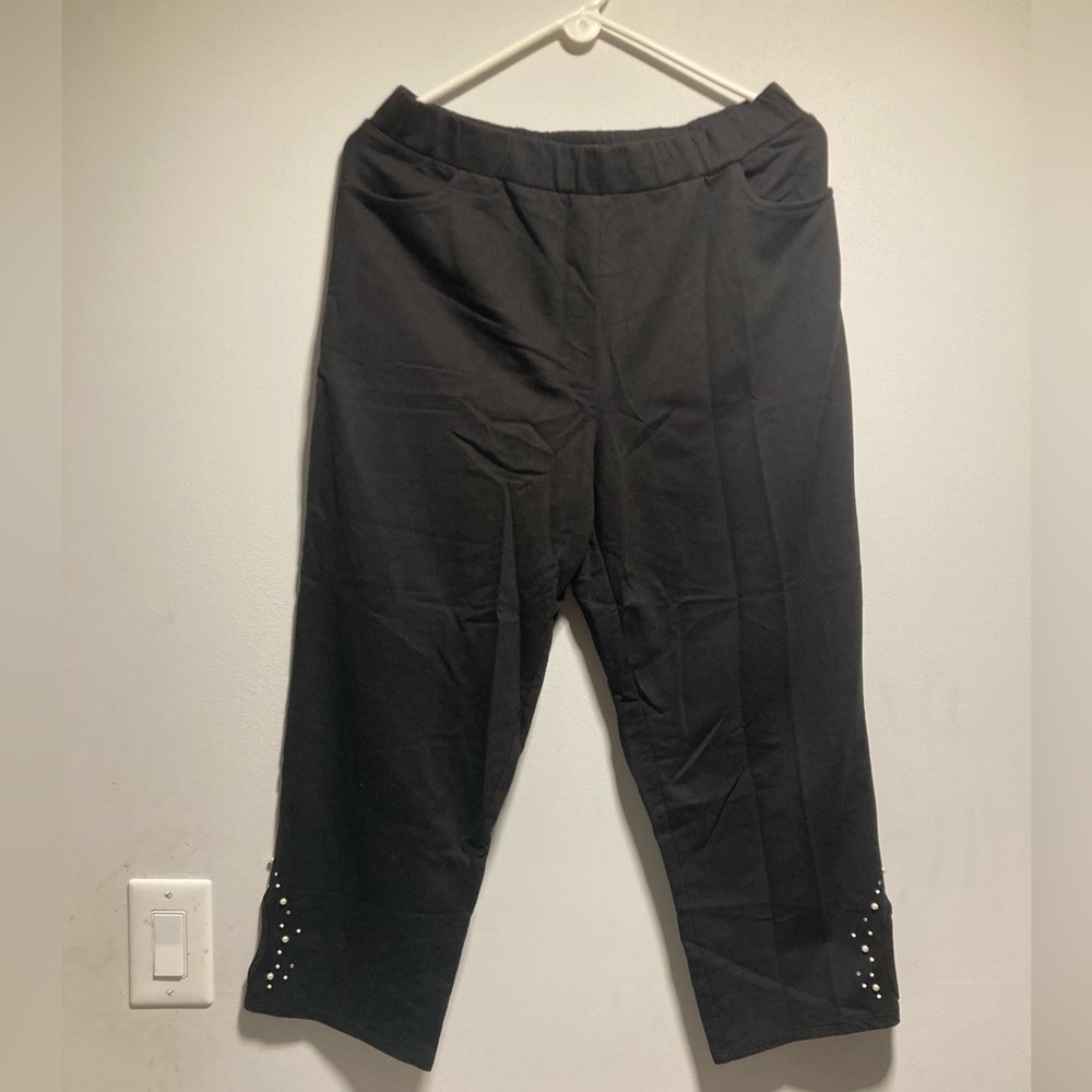 NWT Quaker Factory M black capri pants. Studded leg with peek-abo cut out!